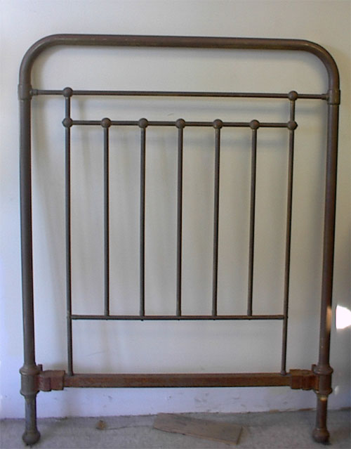 restored brass bed before