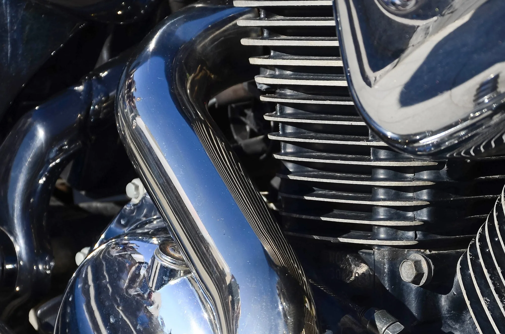 close up fragment of chromed shiny body part of old classic motorbike 2
