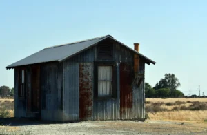 metal old rusty hut in the middle of a dry field on a sunny day 2
