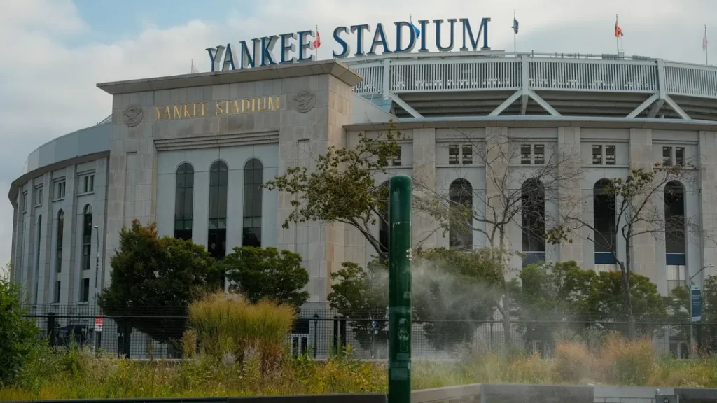 Yankee Stadium in the Bronx, New York, seen from street level with its limestone facade and tall arched windows