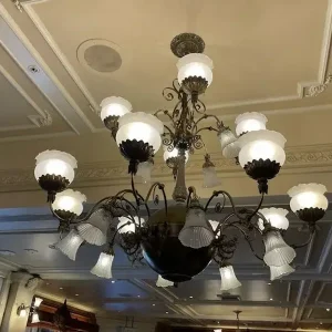 metal man restoration chandelier cleaned in place at disney world